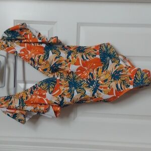 New with tags size M ruffled sleeve swimsuit. Orange yellow teal